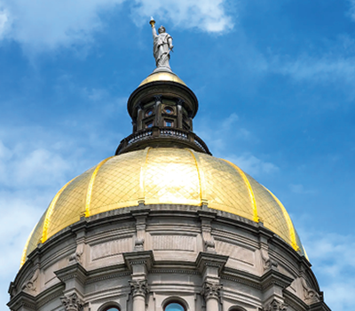 A close up of the gold dome on the Georgia Capitol building.