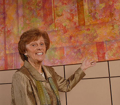 Alana Shepherd , co-founder of Shepherd Center , stands in front of one of Shepherd Center's many works of art.
