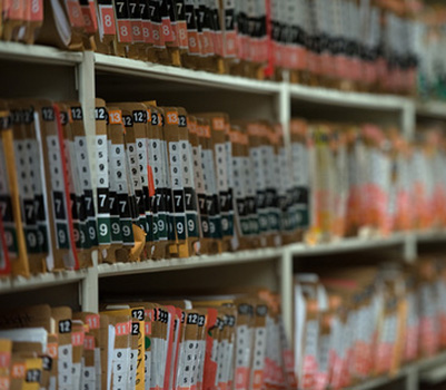A close up view of rows of cabinets holding medical files.