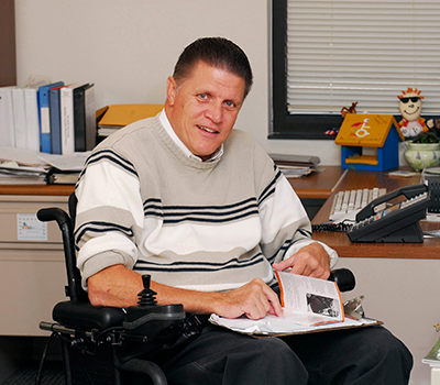 Mark Johnson, the director of advocacy at Shepherd Center, sits at his desk.