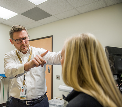 Russell Gore, M.D., evaluates a patient in the Complex Concussion Clinic at Shepherd Center.
