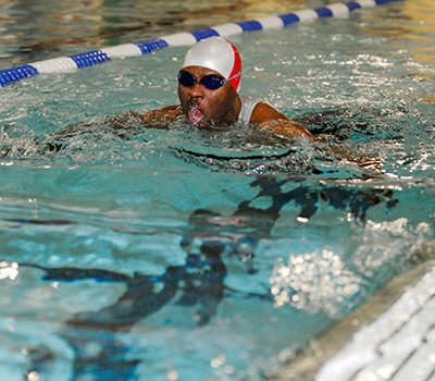 A man swims in the Livingston Gym pool as part of recreation therapy.