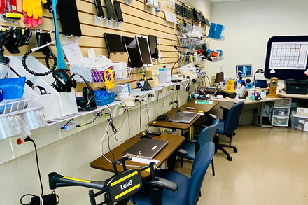 A shot of the Access Technology Lab at Shepherd Center, showcasing walls filled with a variety of assistive technology equipment and devices available for trial.