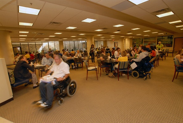 Patients and staff eat a meal in the cafeteria at Shepherd Center in Atlanta, Georgia
