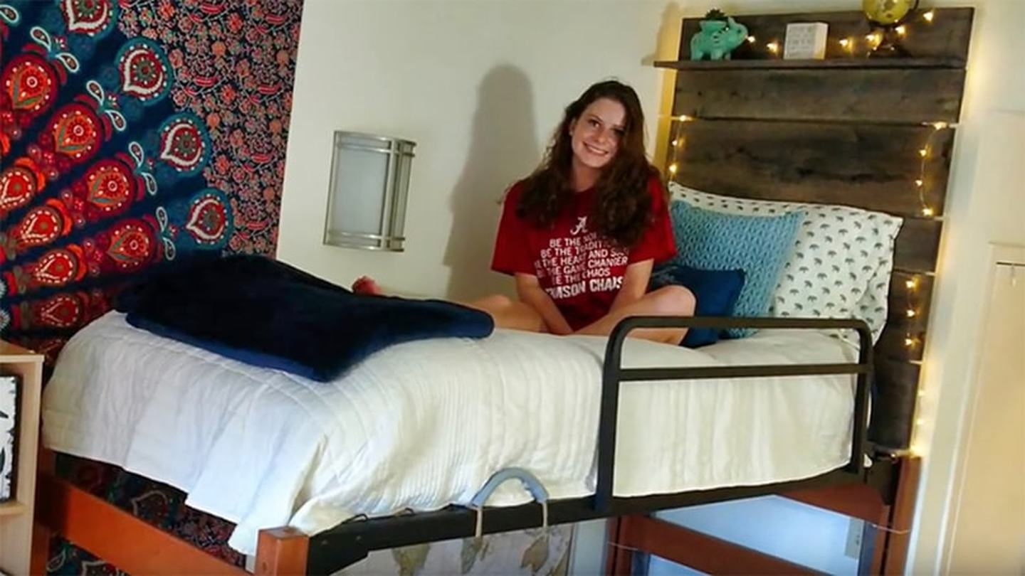 Young woman uses safety rails for her bunkbed to prevent injury