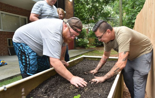 SHARE clients planting a vegetable garden as part of a horticulture therapy component to rehabilitation