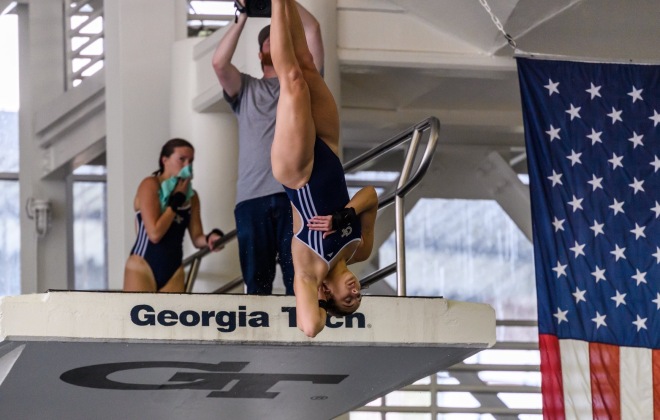 Jordyn Sak, a patient in the Concussion Clinic, dives into a pool at the Intrasquad Meet.