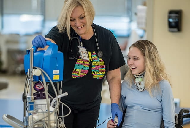 Respiratory Therapist Kelley Taylor with adolescent patient