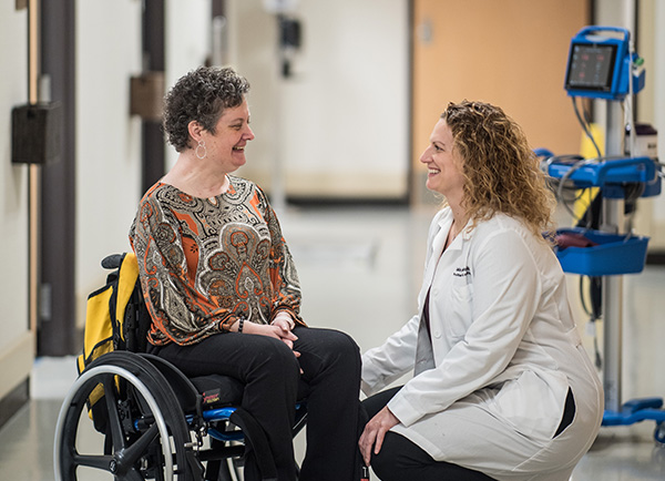 Patient Carla White discusses her care plan with Angela Beninga, D.O.