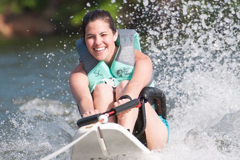 A Shepherd Center patient waterskis at a recreation therapy event