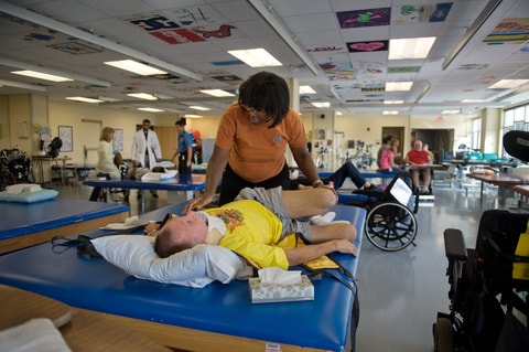 A patient recovery specialist meets with a patient at Shepherd Center, a rehabilitation hospital in Atlanta